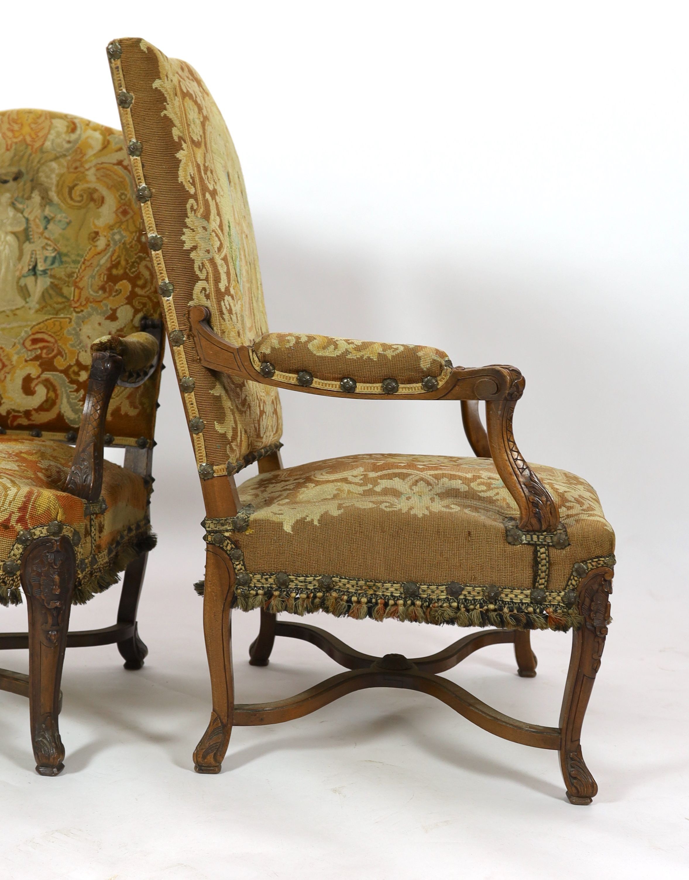 A pair of 19th century French walnut fauteuils W. 75cm. D. 78cm. H. 112cm.